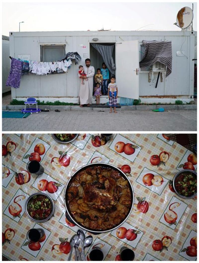 Syrian refugee Ahmet Ilevi, 35, standing in front of the container, where he has lived with his wife (not seen) and five children since 2013 at the Harran refugee camp, in Sanliurfa province, Turkey on June 6, 2016. Ahmet Ilevi was a police officer in Homs before he fled Syria as a refugee with his family. “Ramadan means peace for us. The only thing that breaks this peace is the thought of relatives left behind in Syria. I miss them every day. Ramadan in my homeland was more beautiful than this,” he says. The family break their fast with a meal of chicken with potatoes and salad. Photo by Umit Bektas