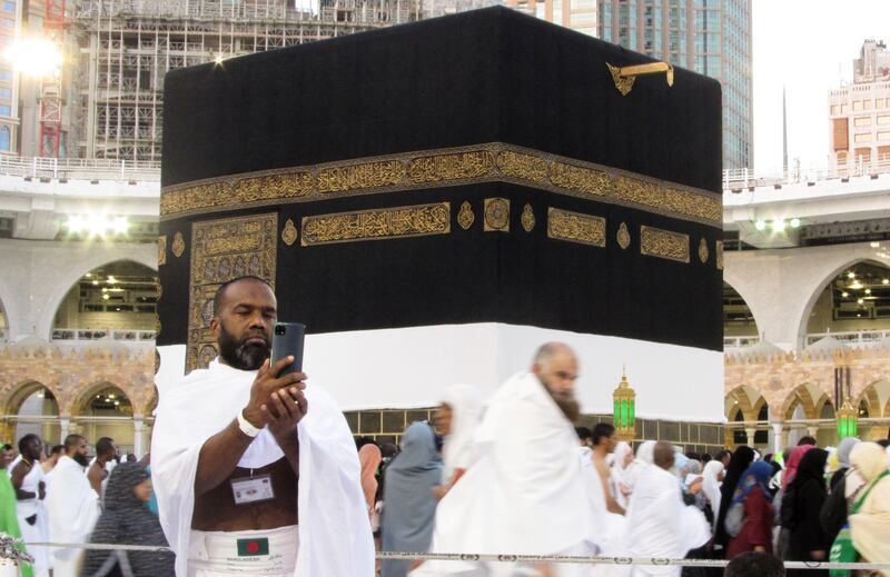 A Bangladeshi pilgrim poses for a selfie in front of the Kaaba at the Grand Mosque. AP