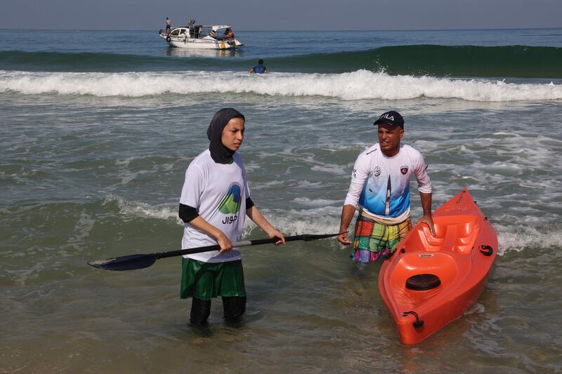 Palestinians take part in a local canoeing championship off the coast of Gaza city.