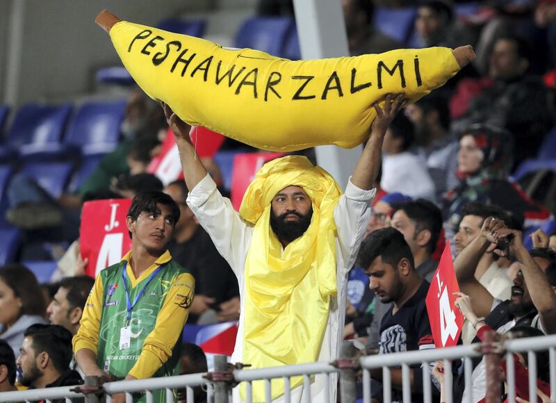 Sharjah, United Arab Emirates - February 21, 2019:  A fan holds up a giant banana during the game between Peshawar Zalmi and Karachi Kings in the Pakistan Super League. Thursday the 21st of February 2019 at Sharjah Cricket Stadium, Sharjah. Chris Whiteoak / The National