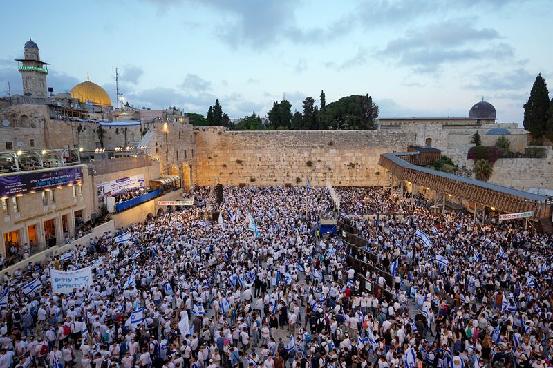 Thousands of Israelis dance and wave national flags during a march marking Jerusalem Day. AP Photo