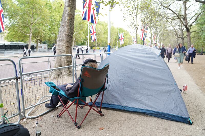People start to camp on The Mall ahead of Queen Elizabeth's coffin being taken from Buckingham Palace on Wednesday afternoon by procession on a Gun Carriage to the Palace of Westminster. PA