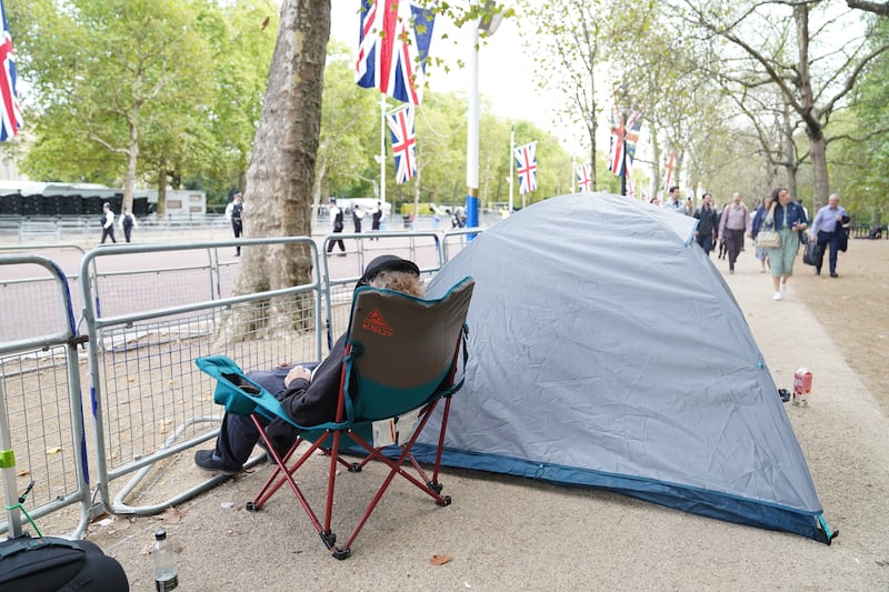 People start to camp on The Mall ahead of Queen Elizabeth's coffin being taken from Buckingham Palace on Wednesday afternoon by procession on a Gun Carriage to the Palace of Westminster. PA