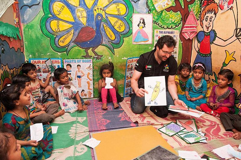 Dubai Cares chief executive Tariq Al Gurg with pupils in India who are being helped in an initiative run in conjunction with an Indian NGO. Courtesy Dubai Cares