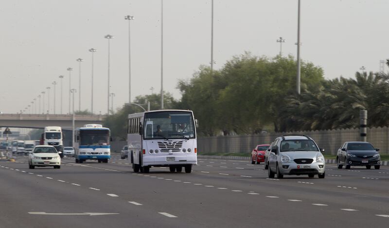 ABU DHABI - UNITED ARAB EMIRATES - 10AUG2016 - Vehicle speeding on Mussafah highway this is to illustrate a story on a plan to reduce the speed buffer for trucks, buses and taxis in Abu Dhabi. Ravindranath K / The National (for News) ID: 66635 *** Local Caption ***  RK1008-trucks08.jpg