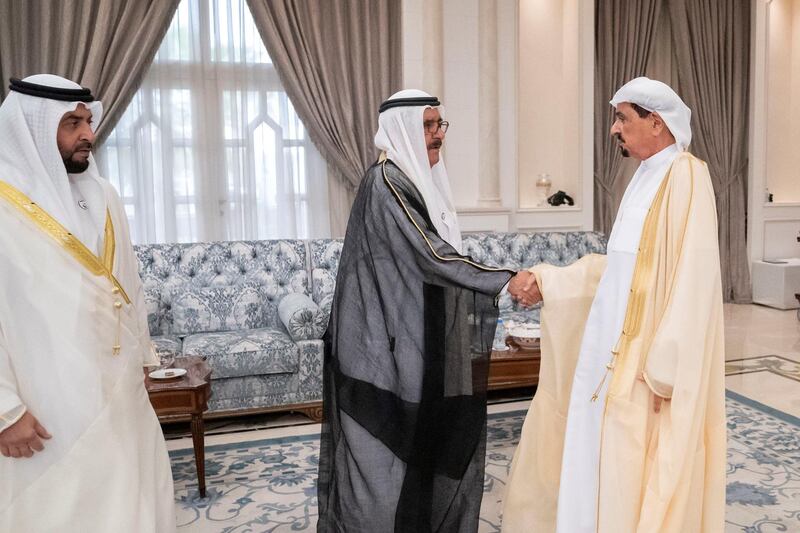 ABU DHABI, UNITED ARAB EMIRATES - August 11, 2019: HH Sheikh Hamdan bin Rashid Al Maktoum, Deputy Ruler of Dubai and UAE Minister of Finance (C), greets HH Sheikh Humaid bin Rashid Al Nuaimi, UAE Supreme Council Member and Ruler of Ajman (R), during  an Eid Al Adha reception at Mushrif Palace. Seen with HH Sheikh Hamdan bin Zayed Al Nahyan, Ruler’s Representative in Al Dhafra Region (L). 
( Eissa Al Hammadi / Ministry of Presidential Affairs )
---