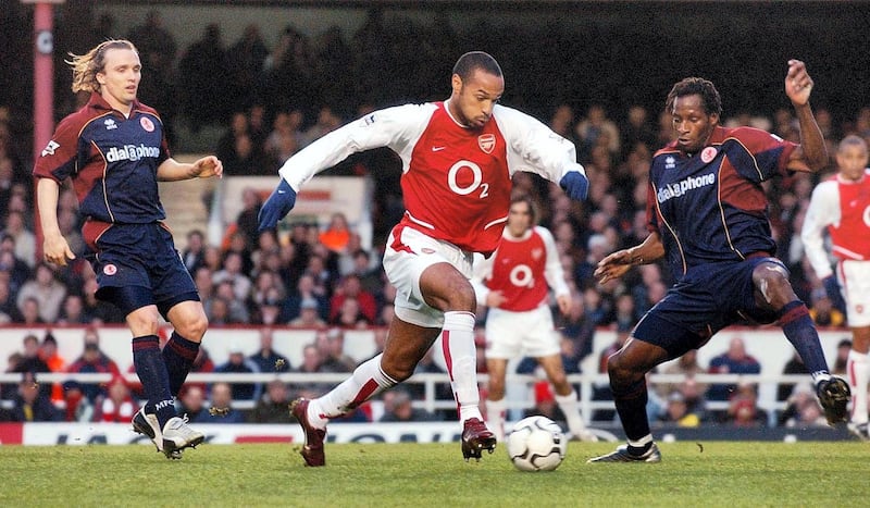 Arsenal's Thierry Henry (centre) goes through the Middlesbrough's defence during the Barclaycard Premiership match at Highbury, London, Saturday January 10, 2004.    THIS PICTURE CAN ONLY BE USED WITHIN THE CONTEXT OF AN EDITORIAL FEATURE. NO WEBSITE/INTERNET USE UNLESS SITE IS REGISTERED WITH FOOTBALL ASSOCIATION PREMIER LEAGUE.   (Photo by Sean Dempsey - PA Images/PA Images via Getty Images)