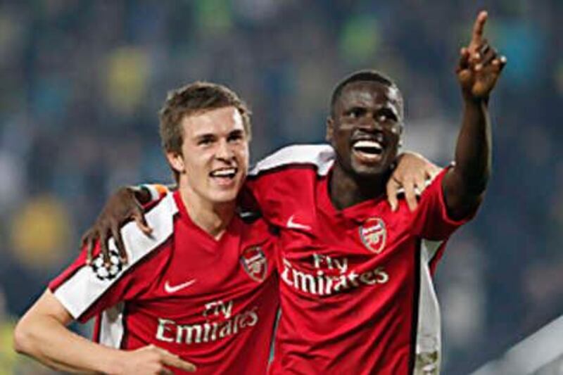 Aaron Ramsey, left, and Emmanuel Eboue of Arsenal celebrate after Ramsey's goal against Fenerbahce during their Group G Champions League soccer match at Sukru Saracoglu stadium in Istanbul, Turkey, Tuesday, Oct. 21, 2008. Arsenal won 5-2. (AP Photo) *** Local Caption ***  IST116_Turkey_Soccer_Champions_League.jpg