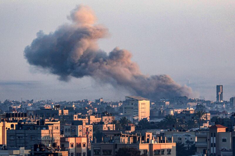 Smoke billows over Khan Younis in the southern Gaza Strip during Israeli bombardment on December 30, 2023. AFP