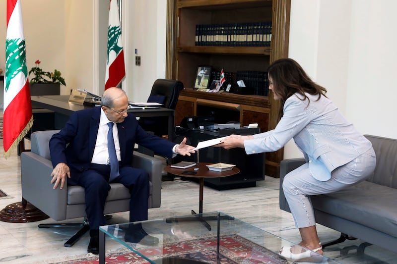 Lebanese President Michel Aoun receives the proposals document from US ambassador Dorothy Shea on Saturday. AP