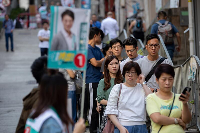 Long lines formed outside Hong Kong polling stations. EPA