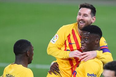 Barcelona's Spanish midfielder Ilaix Moriba (R) celebrates with Barcelona's Argentinian forward Lionel Messi and Barcelona's French forward Ousmane Dembele after scoring during the Spanish League football match between CA Osasuna and FC Barcelona at El Sadar stadium in Pamplona on March 6, 2021. / AFP / ANDER GILLENEA