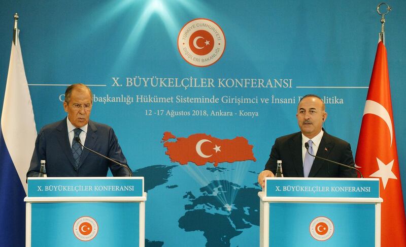 epa06949233 Turkish Foreign Minister Mevlut Cavusoglu (R) and Russian Foreign Minister Sergei Lavrov (L) during their press conference after their meeting at the 10th Ambassador Conference in Ankara, Turkey, 14 August 2018. The Conference takes place under the topic 'Enterprising and Humanitarian Foreign Policy in the Presidential System of Government'.  EPA/STR