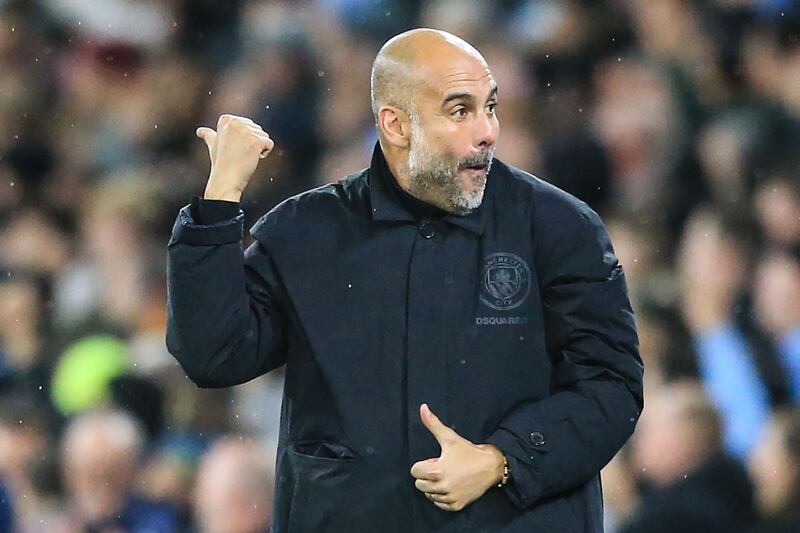 Manchester City manager Pep Guardiola celebrates after  Haaland scored his second goal. AFP