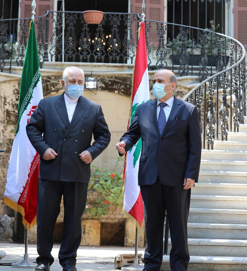 Iran's Foreign Minister Mohammad Javad Zarif and Lebanon's caretaker Foreign Minister Charbel Wehbe wear protective face masks during a news conference at the Ministry of Foreign Affairs in Beirut. Reuters