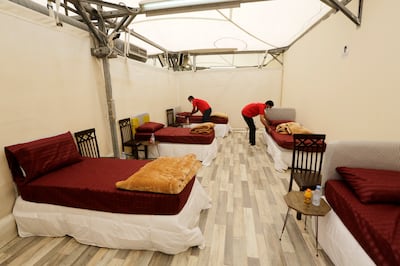 Workers set up accommodation for pilgrims at a tent camp in Mina. AP