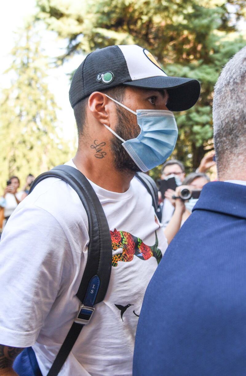 Suarez leaves Perugia's University in Perugia, Italy. EPA
