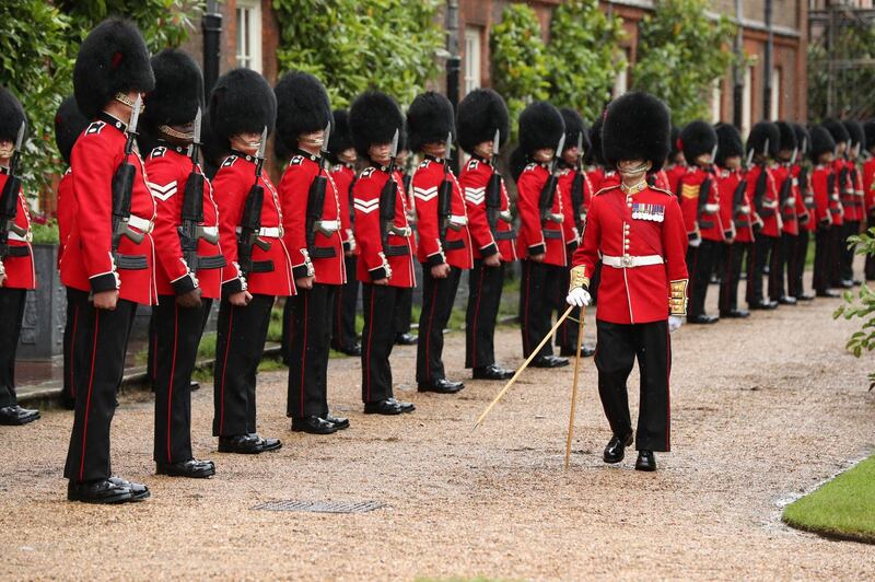 A Guard of Honour of the Coldstream Guards for French president Emmanuel Macron as he arrives at Clarence House. Getty Images