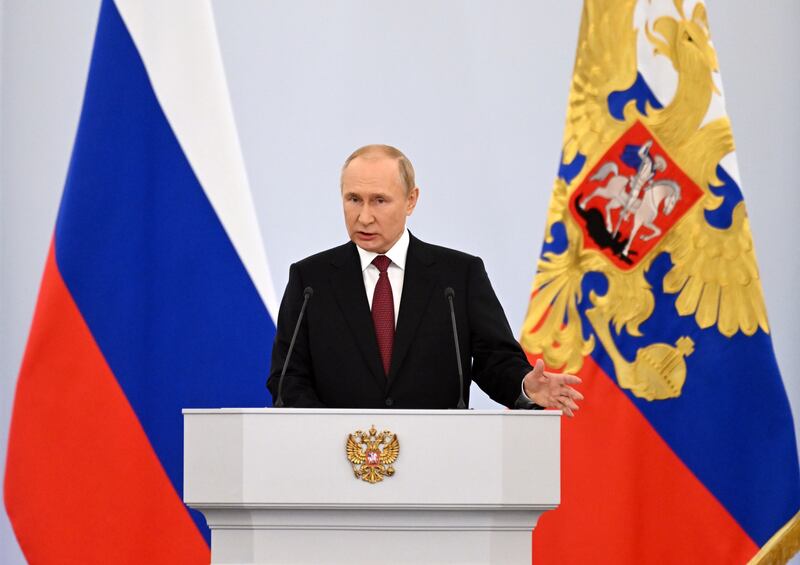 Mr Putin speaks during the ceremony to sign the treaties for the new territories' accession to Russia at the Grand Kremlin Palace in Moscow. EPA