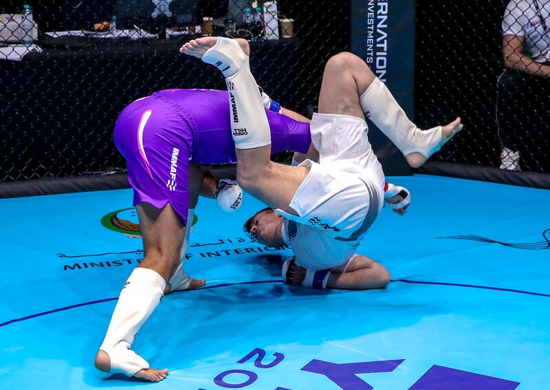 Marcello Zappala of Italy (purple) flips Tinus Bernard of South Africa.