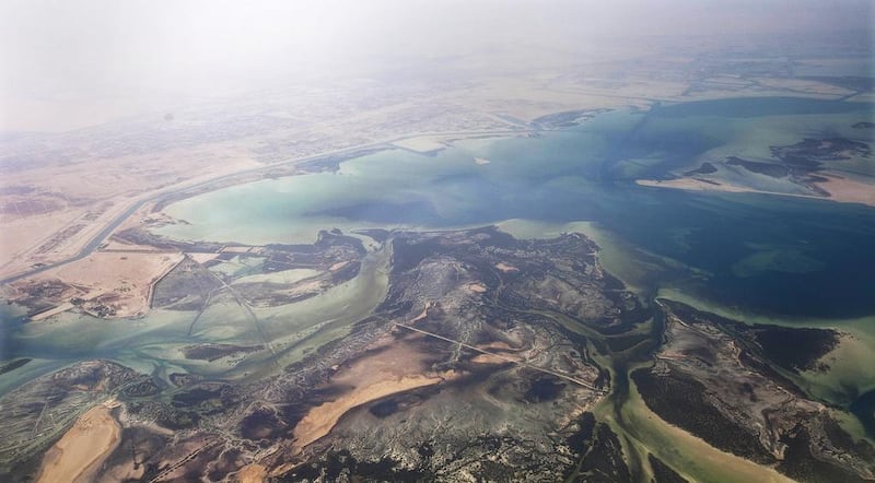 Abu Dhabi's mainland and island coastlines could be at risk from rising sea levels. Razan Alzayani / The National