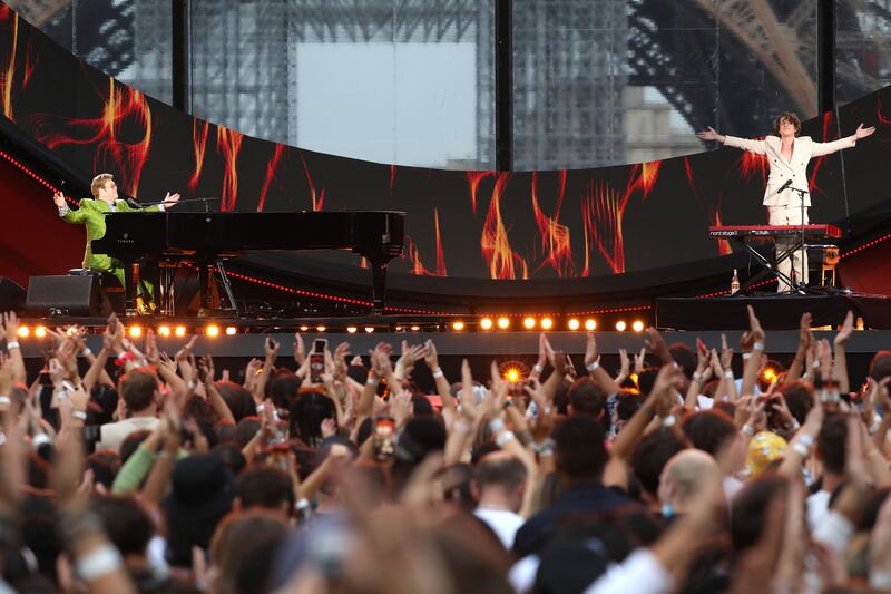 Elton John and Charlie Puth perform on stage during Global Citizen Live in Paris, France. Getty Images