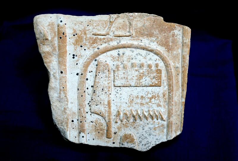 This undated photo released by the Egyptian Ministry of Antiquities on Tuesday, Jan. 8, 2019, shows a  illegally smuggled, artifact repatriated from the United Kingdom. Tuesdayâ€™s statement said the newly recovered relief with cartouche of King Amonhotep I from the 18th dynasty, was on display at a London auction house. It said the relief was originally exhibited at the open museum of the ancient temple of Karnak in the city of Luxor. It didnâ€™t say how the artifact was smuggled out of the country. (Egyptian Ministry of Antiquities via AP)