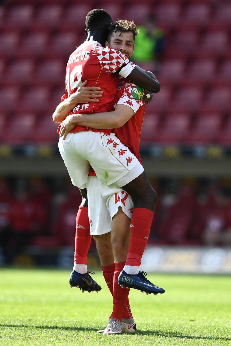 Mainz players Moussa Niakhate, left, and Alexander Hack celebrate after defeating Bayern Munich. EPA