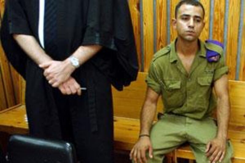 Taysir Hayb, an Israeli Bedouin soldier, sits in a courtroom prior to a session of his trial in the Kastina Military Court in July 2004.