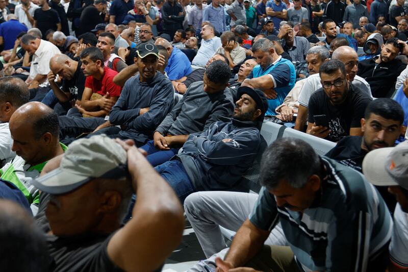 Palestinian workers gather in the waiting hall at the reopened Erez crossing. Reuters
