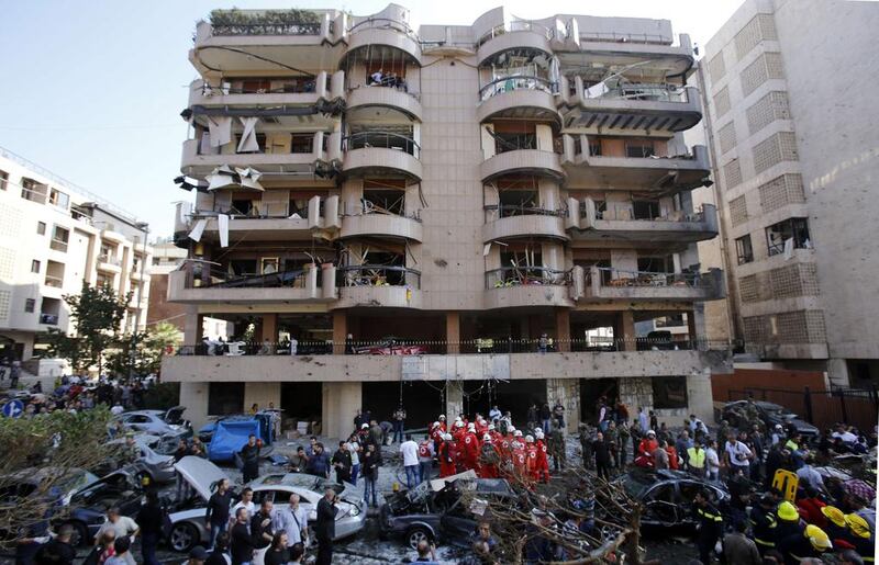 Lebanese soldiers and emergency personnel gather at the site of a blast in Bir Hassan neighbourhood in southern Beirut. Anwar Amro / AFP Photo

