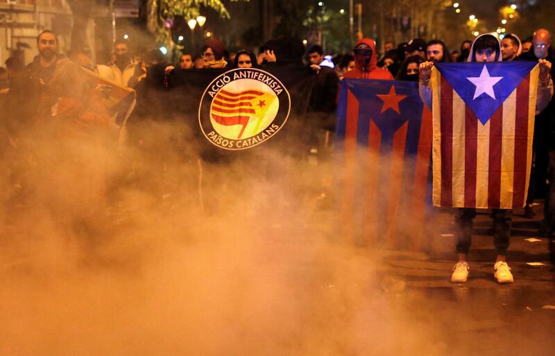 Protesters burn containers. EPA