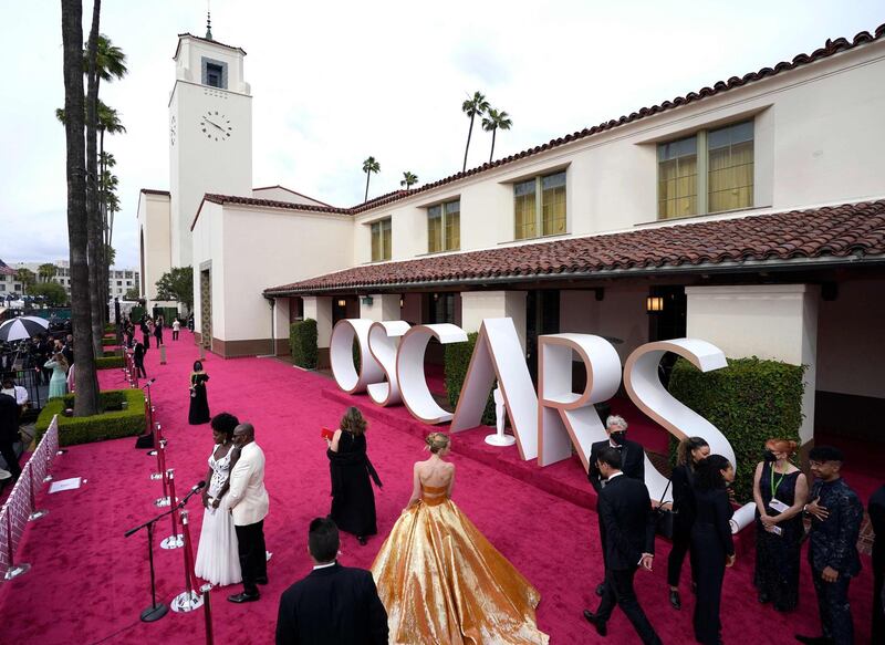 Viola Davis and Julius Tennon are interviewed while Carey Mulligan (centre, bottom) walks the red carpet at the Oscars on April 25, 2021, at Union Station in Los Angeles. AFP