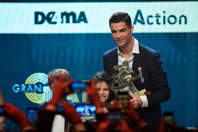 Cristiano Ronaldo receives his award for Best Player at the Gran Gala del Calcio 2019 ceremony. AFP