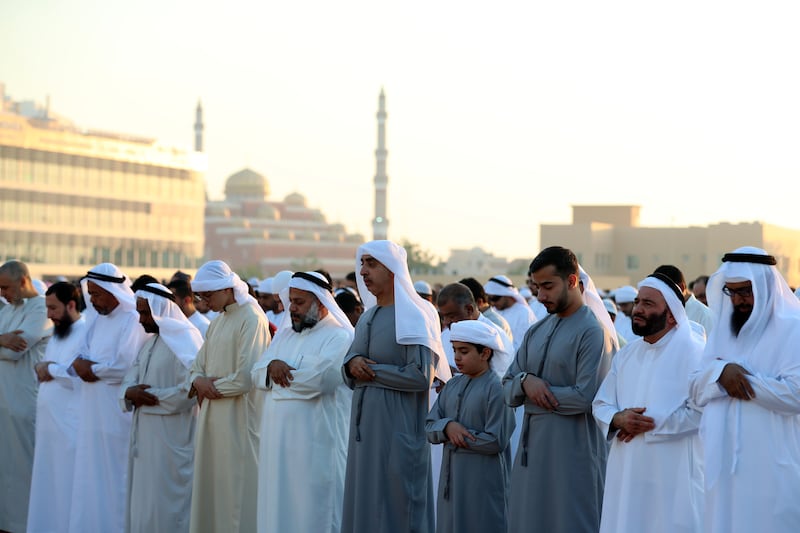 Morning prayers on the first day of Eid in Al Barsha. Chris Whiteoak / The National