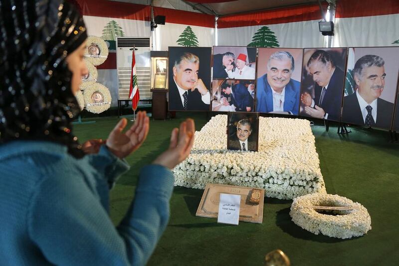 A woman prays at the grave of assassinated former Lebanese prime minister Rafik Hariri in downtown Beirut. Mohamed Azakir / Reuters