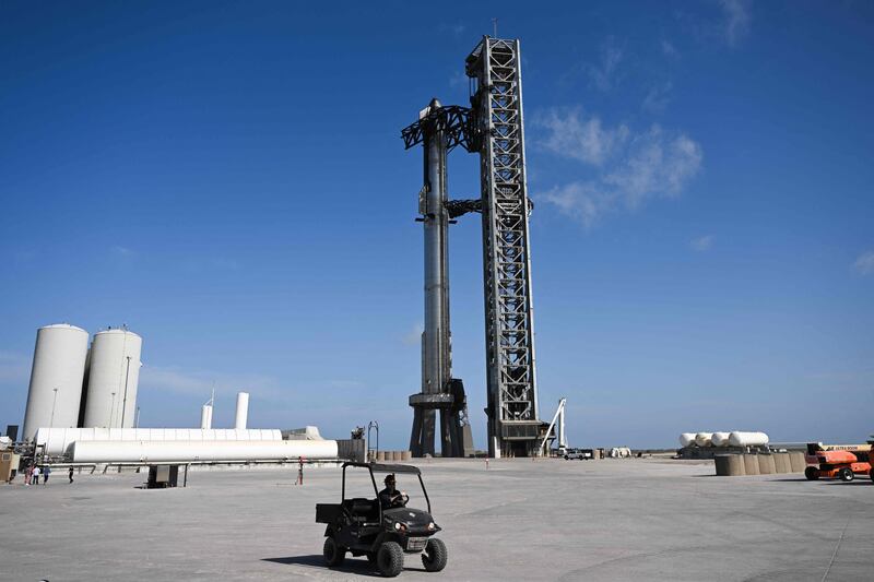 The SpaceX Starship with a booster stands on the launch pad ahead of its flight test from Starbase. AFP
