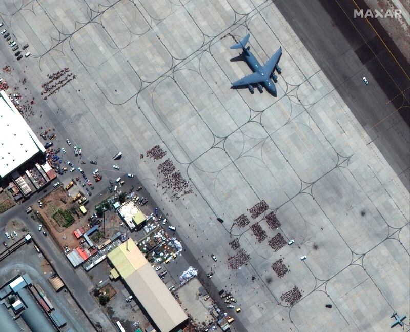 A military aircraft waits at Kabul airport on Monday. AP