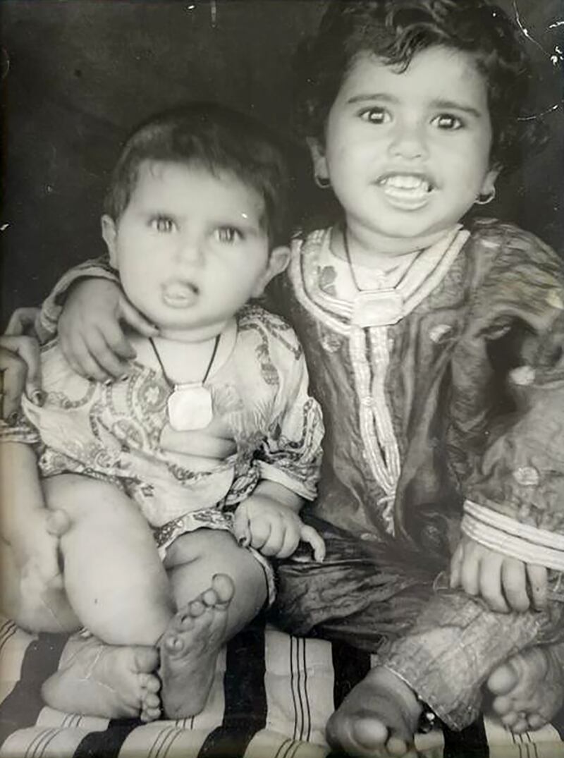 As a young girl, right, with her sister in 1958. Photo: Moza Tahwara