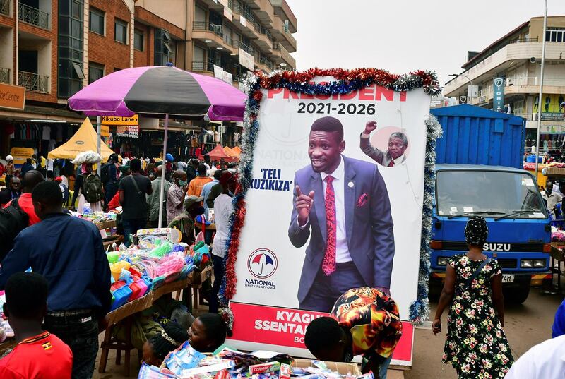 An electoral campaign poster of Bobi Wine is seen on a street ahead of the presidential and parliamentary elections, in Kampala. Reuters