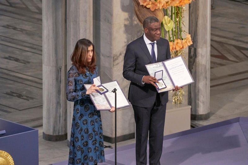OSLO, NORWAY - DECEMBER 10:  Dr. Denis Mukwege and Nadia Murad pose on stage after receiving the Nobel Peace Prize 2018 at Oslo City Town Hall on December 10, 2018 in Oslo, Norway. The Congolese gynaecologist, Denis Mukwege, who has treated thousands of rape victims, and Nadia Murad, the Iraqi Yazidi, who was sold into sex slavery by Isis, have been jointly awarded the 2018 Nobel peace prize in recognition for their efforts to end the use of sexual violence as a weapon in war.  (Photo by Erik Valestrand/Getty Images)