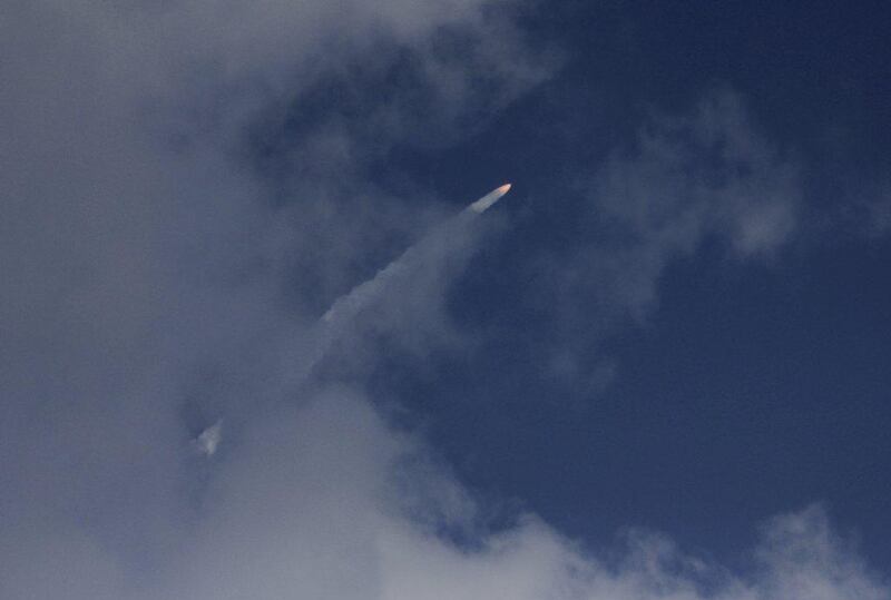 A rocket carrying the Mars orbiter streaks across the sky after taking off from the east-coast island of Sriharikota, India, on November 5, 2013. Photo: AP