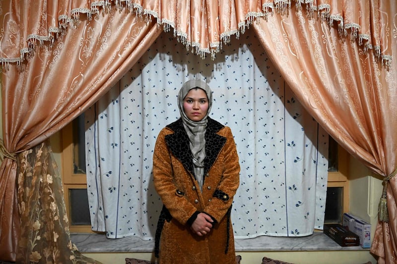 Zakia, an economics student who had to abandon her studies when the Taliban took control of Afghanistan in August, at her home in the capital Kabul, where women are coming together to stand against the hardline regime.  All photos: AFP