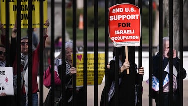 People protest against the Gaza war in a demonstration outside the White House gates. AFP