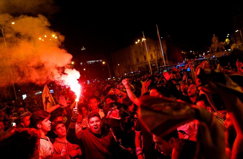 Real Madrid fans celebrate near the Cibeles fountain in central Madrid. Paul Hanna / Reuters