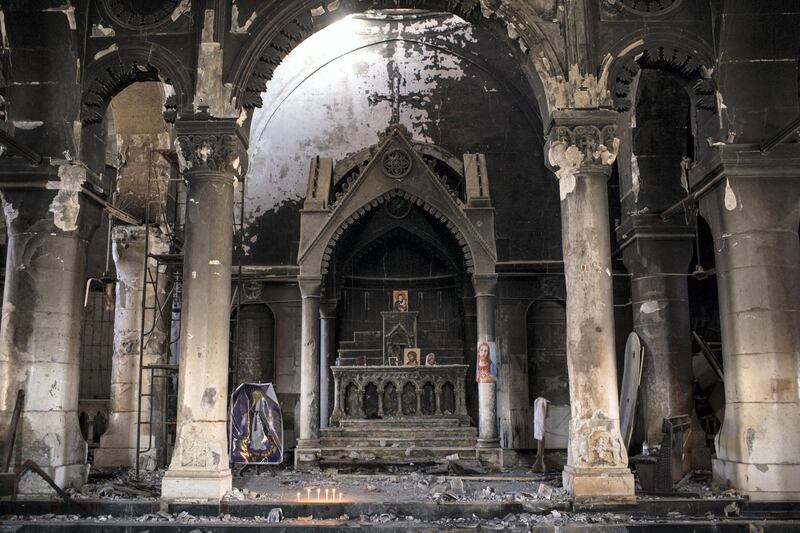 QARAQOSH, IRAQ - NOVEMBER 08: The burnt and destroyed interior of the St Mary al-Tahira church is seen on November 8, 2016 in Qaraqosh, Iraq. The NPU is a military organization made up of Assyrian Christians and was formed in late 2014 to defend against ISIL. Qaraqosh, a largely Assyrian City just 32km southeast of Mosul was taken by ISIL in August, 2014 forcing all residents to flee, the town was largely destroyed with all of the churches burned or heavily damaged. The town stayed under ISIL control last week when it was liberated during the Mosul Offensive.  (Photo by Chris McGrath/Getty Images)