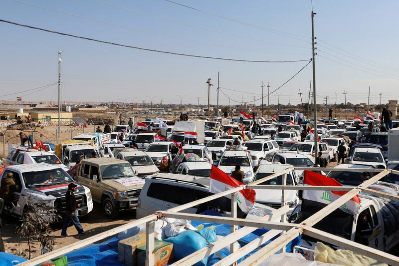 Vehicles containing aid from Hashid Shaabi (Popular Mobilization Forces) on the Iraqi side of the Iraq-Syria border. Reuters