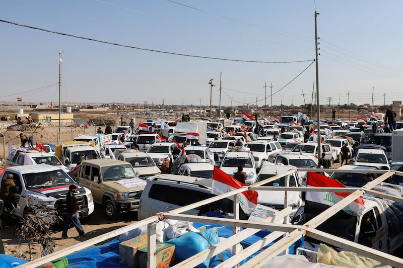 Vehicles containing aid from Hashid Shaabi (Popular Mobilization Forces) on the Iraqi side of the Iraq-Syria border. Reuters