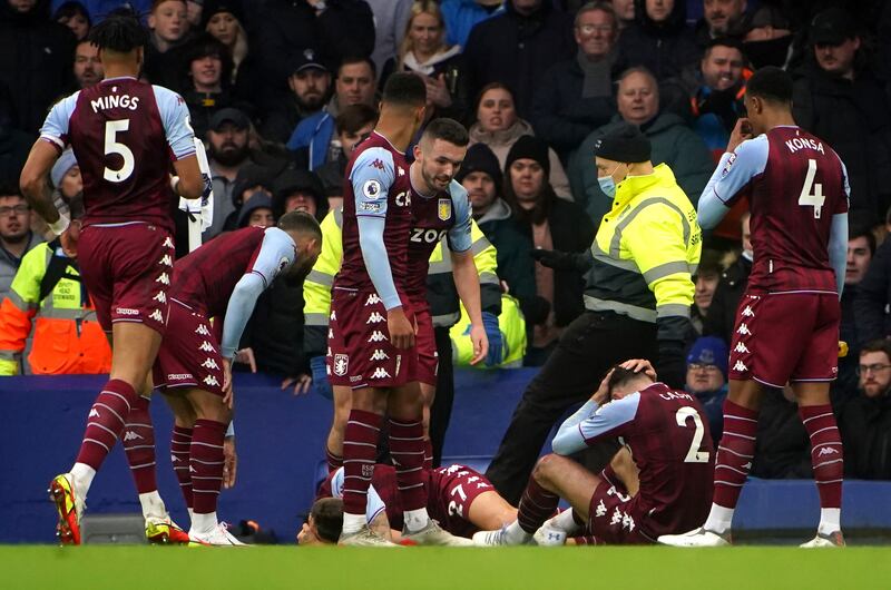Aston Villa's Lucas Digne and Matty Cash were hit by a projectile after Emiliano Buendia scored against Everton on Saturday. PA