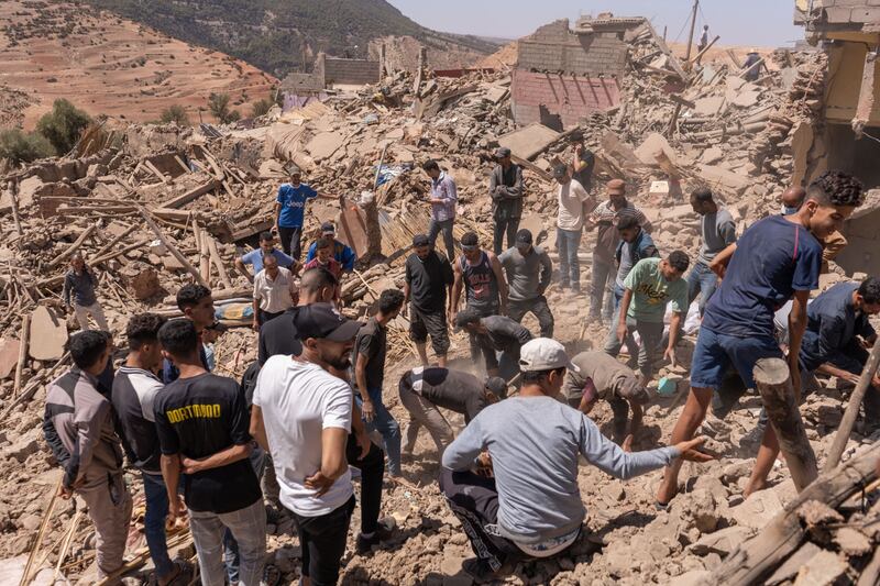 Villagers carry out a search and rescue mission in the rubble of destroyed buildings after the earthquake in Tafeghaghte, in El Haouz region. Bloomberg